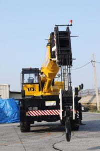 40-ton ACE mobile crane parked in Faridabad, industrial setting.